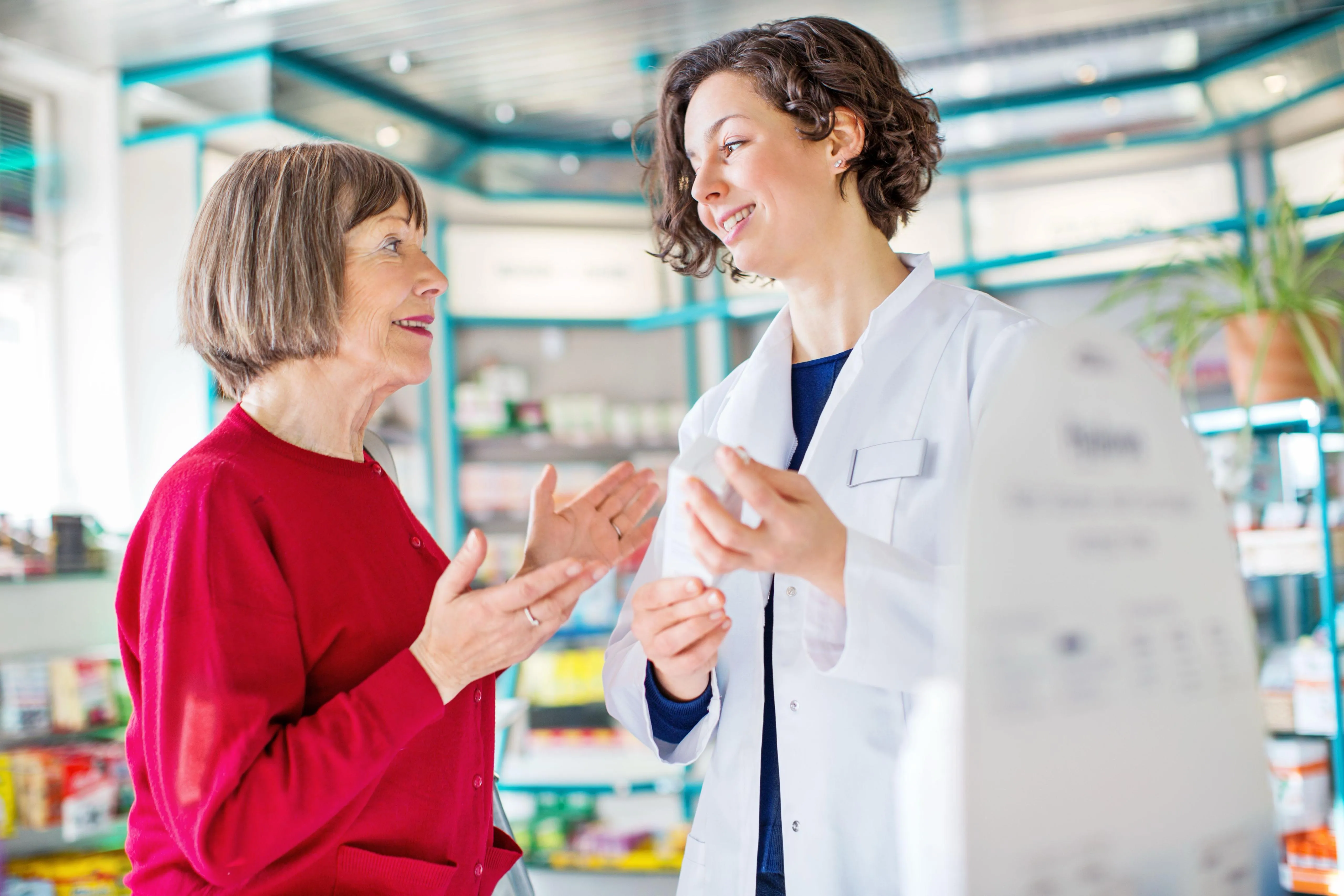 Pharmacist helping patient at River Glen Pharmacy