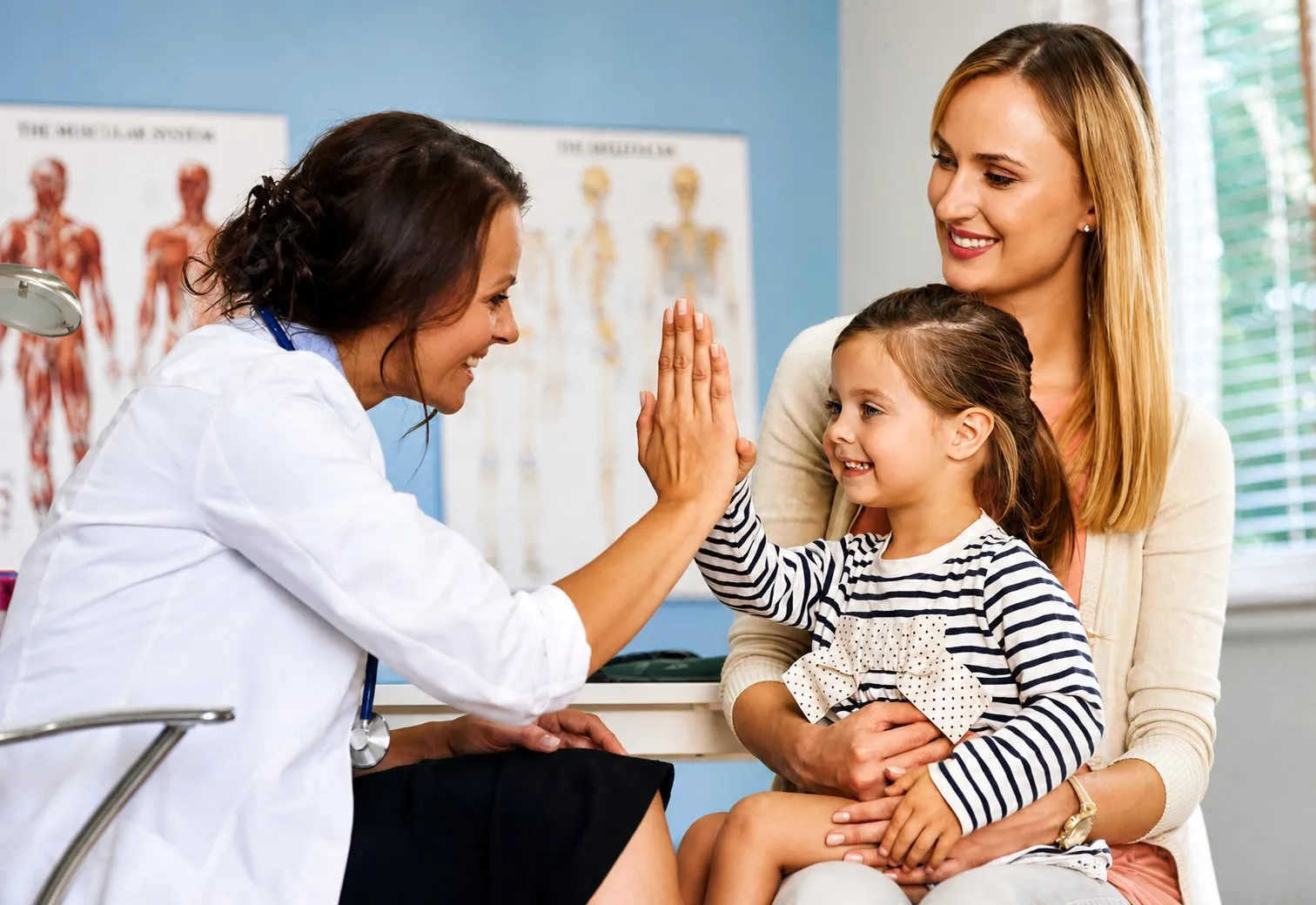 Doctor with young patient at St Michael Medical Centre Oakville