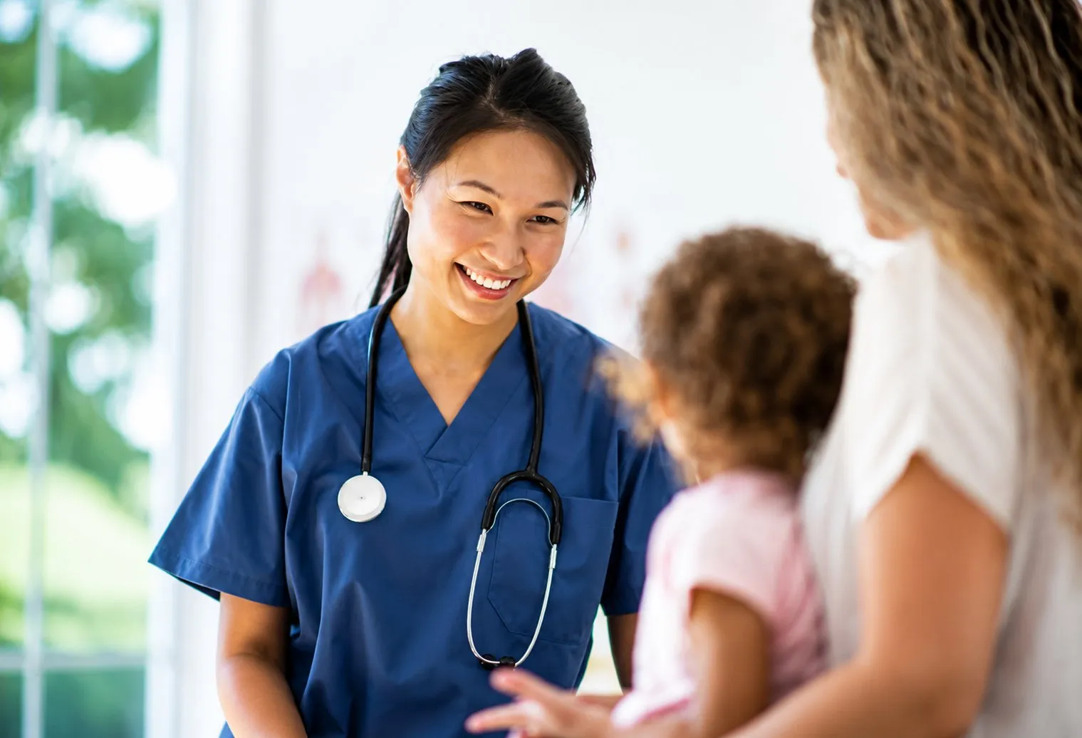 Friendly nurse with child
